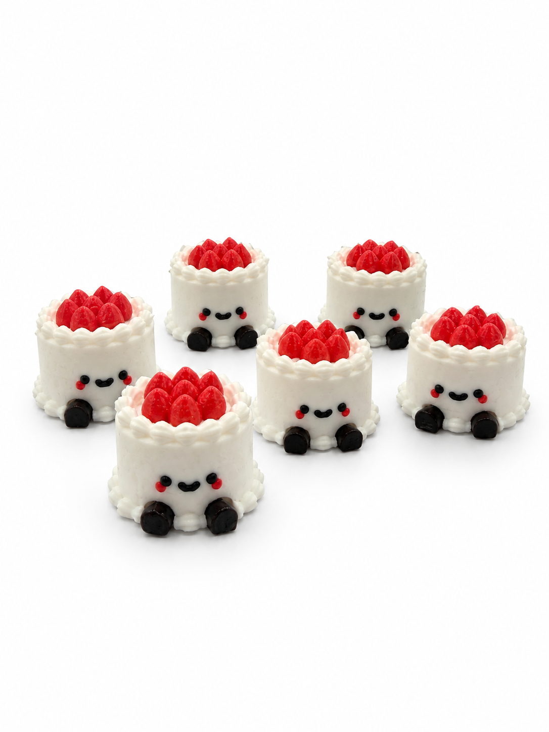 Six small cake-shaped keycaps with smiling faces, white frosting, red berries on top, and black feet, designed as a Cake Clicker from DJM 3D SHOP.