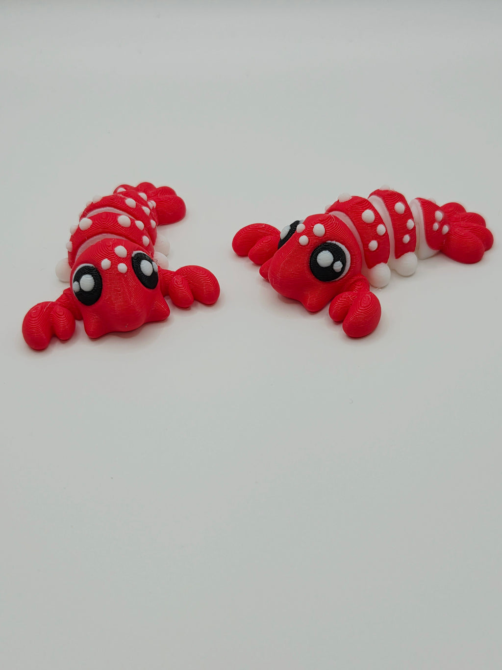 3D articulated baby lobster fidget toy by DJM 3D SHOP, featuring colorful, textured, and bendable lobster-shaped figure for sensory play.
