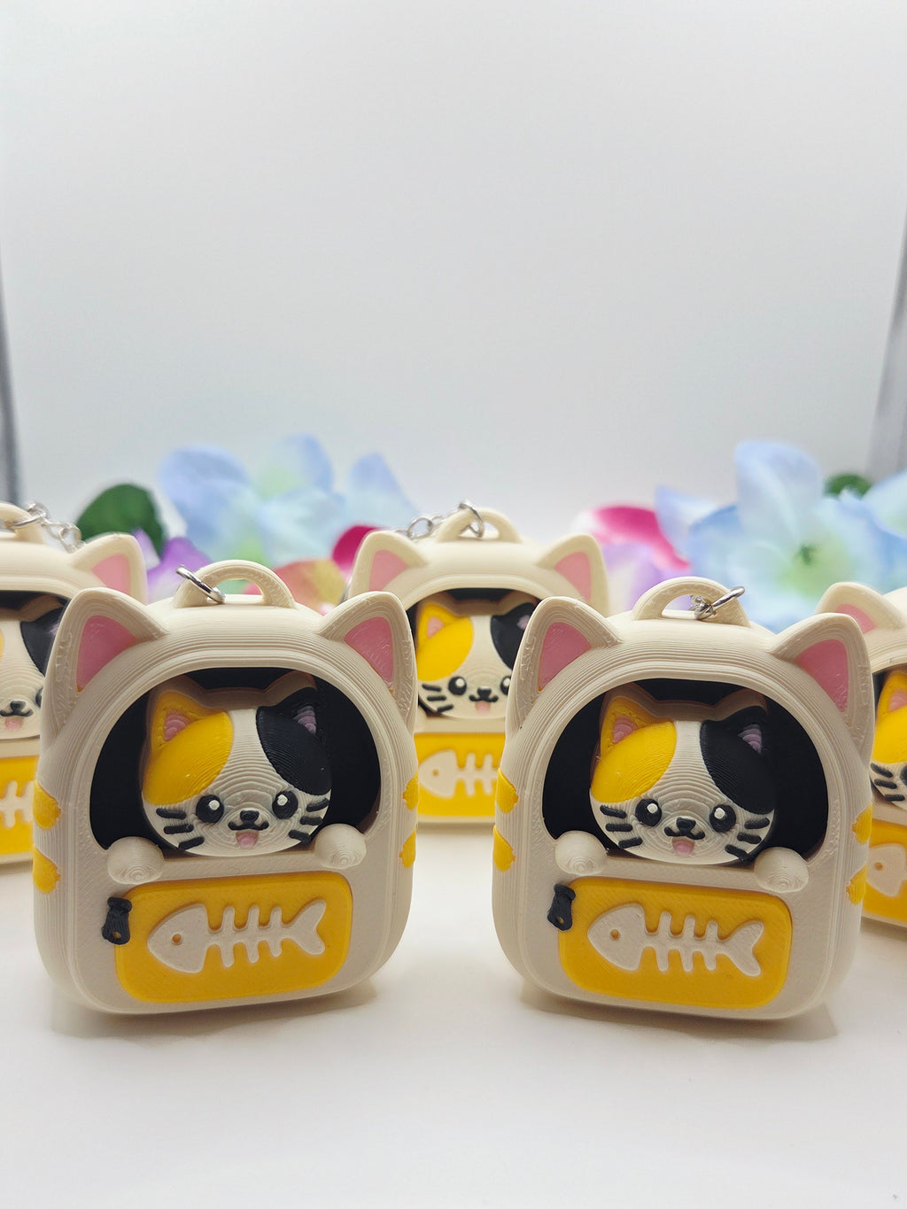 DJM 3D SHOP cat-shaped fidget toy backpack clicker, portable and fun stress-relief accessory for cat lovers.